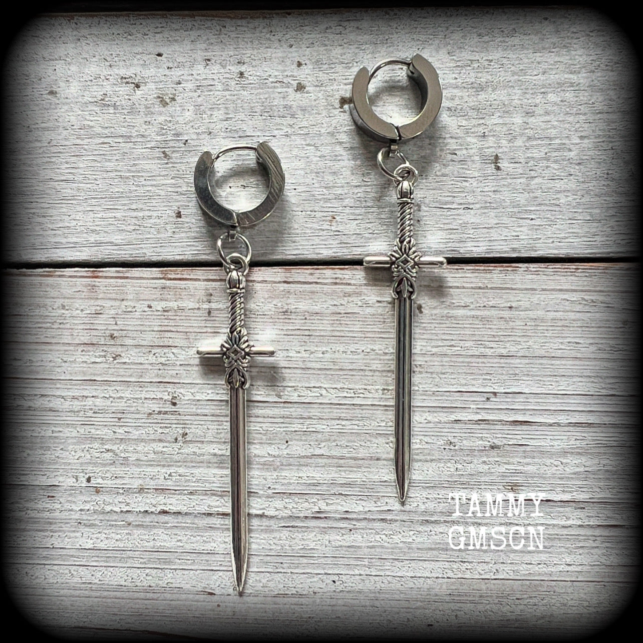 These gorgeous antique silver sword earrings measure just on 7cms from tip to tip, and are nice and light weight, at only 3 grams each.

This pair have been made on stainless steel huggies-suitable for pierced ears. 