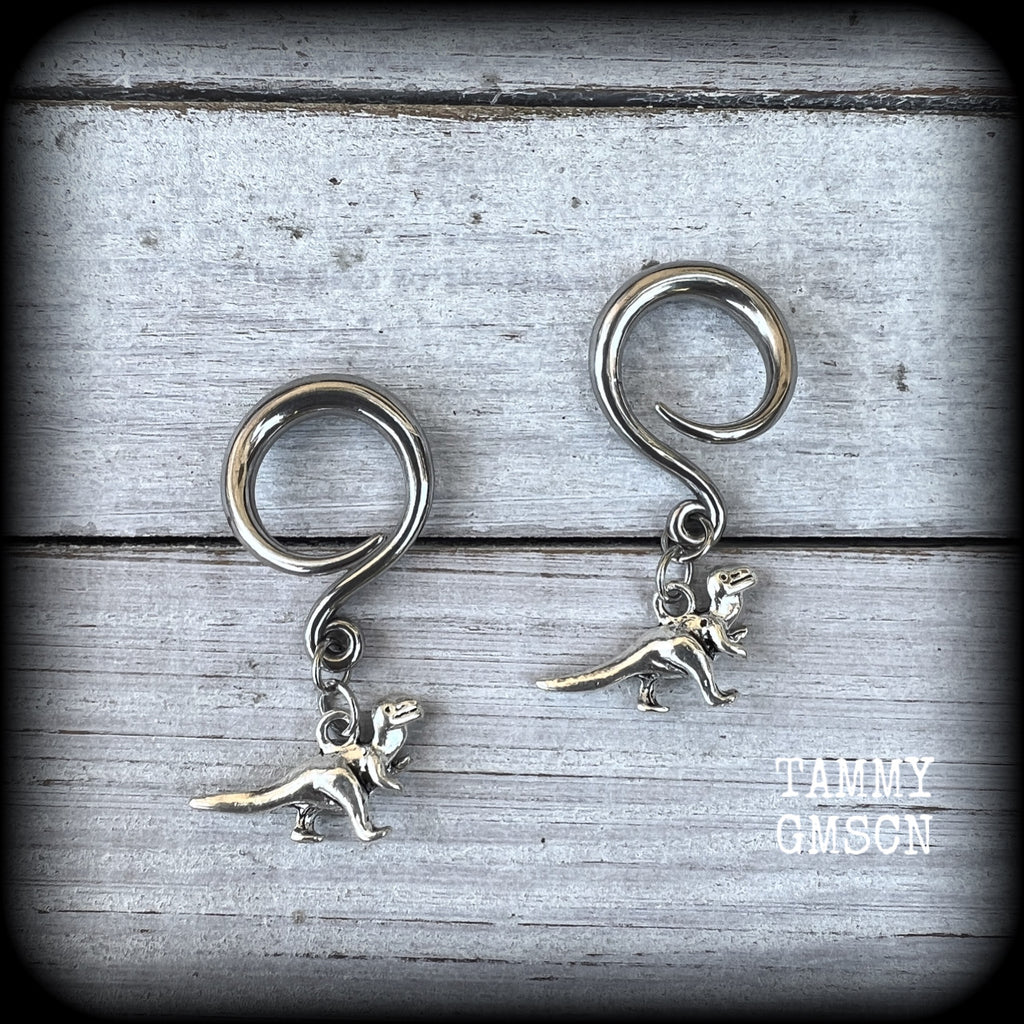 These adorable antique silver Tyrannosaurus rex gauged earrings are nice and light weight at 5 grams a piece, and nice and dangly at 4 cms from tip to tip..

This pair has been made on 6 gauge (4mm) surgical steel full curl hooks, to be worn in stretched lobes.