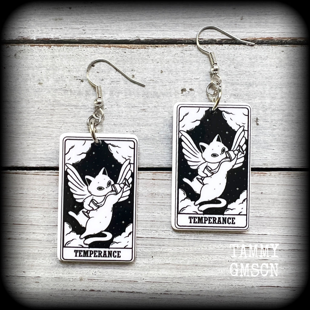 These adorable lightweight acrylic cat tatot card earrings feature 'Temperance' tarot cards, weighing only a few grams each, and measure approx 5cms from tip to tip.

This pair has been made with stainless steel french hooks, for pierced ears.

🐈‍⬛ 🔮We stock these cuties in every major arcana card. If you want to mix and match please just ask!