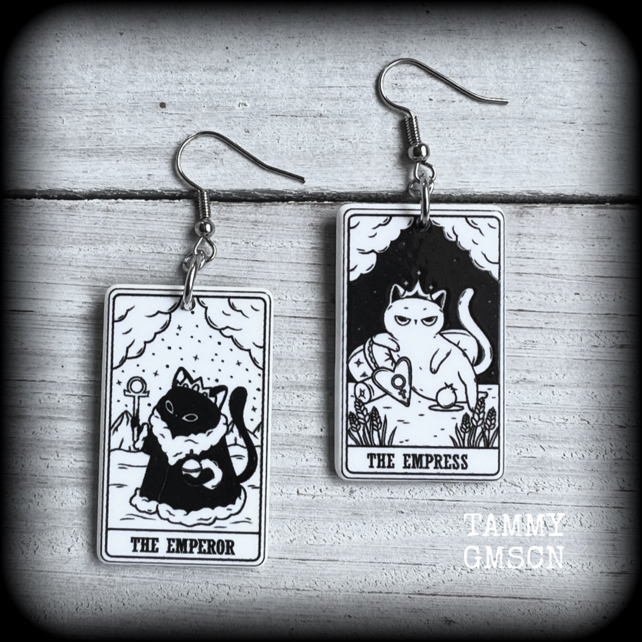 These stunning cat tarot card earrings feature The Emperor and The Empress, black and white lightweight tarot card charms, weighing only a few grams each, and measure approx 5cms from tip to tip.

This pair has been made with stainless steel french hooks, for pierced ears.