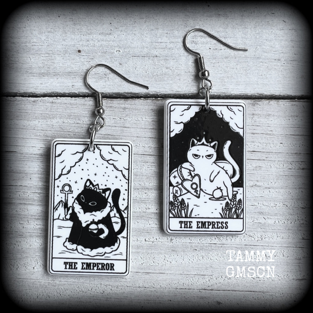 These stunning cat tarot card earrings feature The Emperor and The Empress, black and white lightweight tarot card charms, weighing only a few grams each, and measure approx 5cms from tip to tip.

This pair has been made with stainless steel french hooks, for pierced ears.