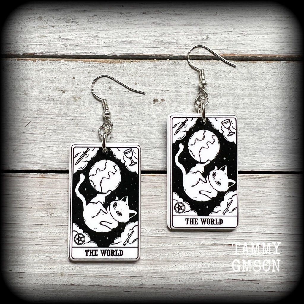 These adorable lightweight acrylic tarot card earrings feature ‘The World’ cat tarot cards, weighing only a few grams each, and measuring approx 5cms from tip to tip.

This pair has been made with stainless steel french hooks, for pierced ears.

🐈‍⬛ 🔮We stock these cuties in every major arcana card. If you want to mix and match please just ask!