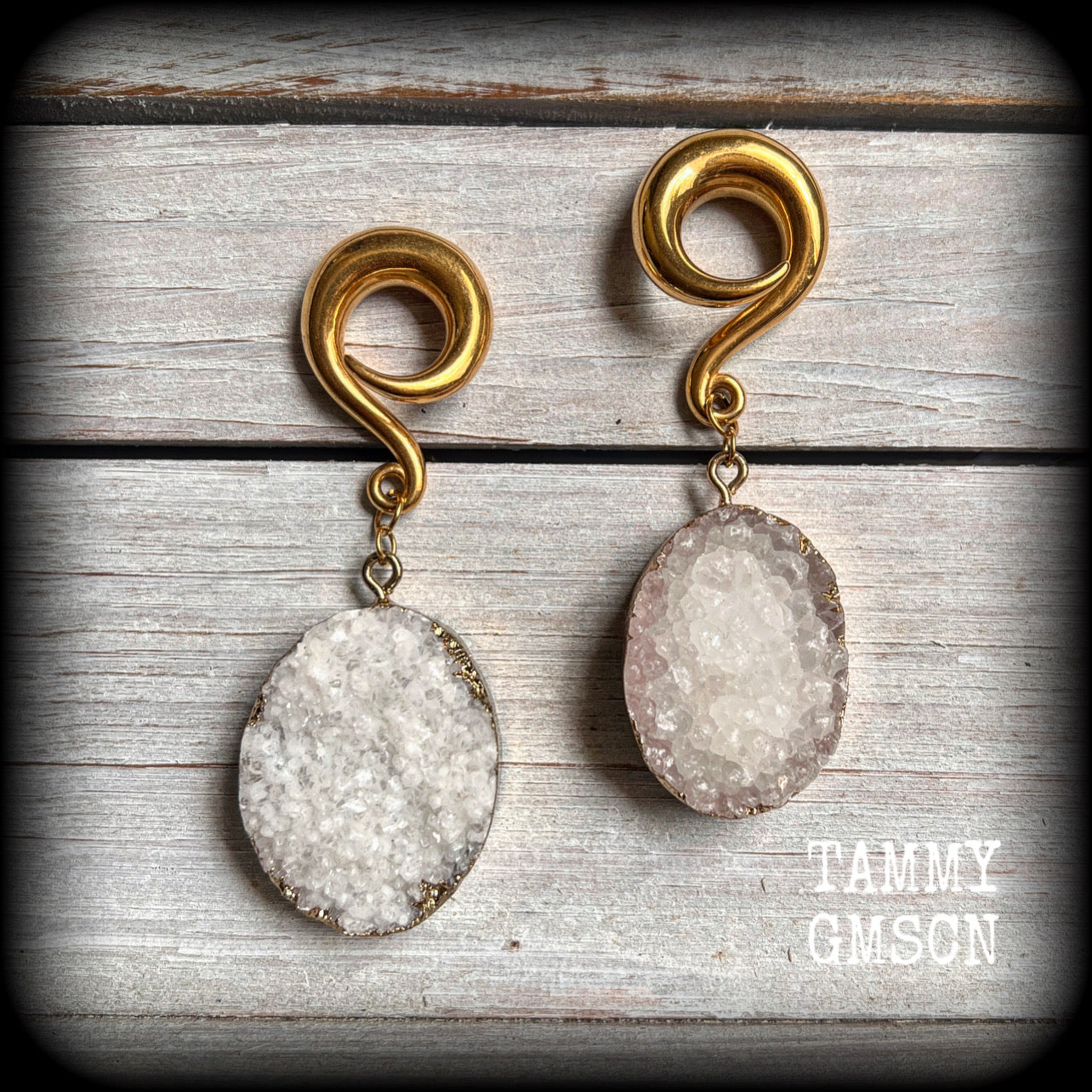 These big beautiful gauged earrings feature snow white and antique gold druzy pieces, measuring just on 8cms from tip to tip, and weighing approx 35 grams a piece.

This pair have been made on 0 gauge (8mm) surgical steel full curl hooks, suitable for stretched lobes.