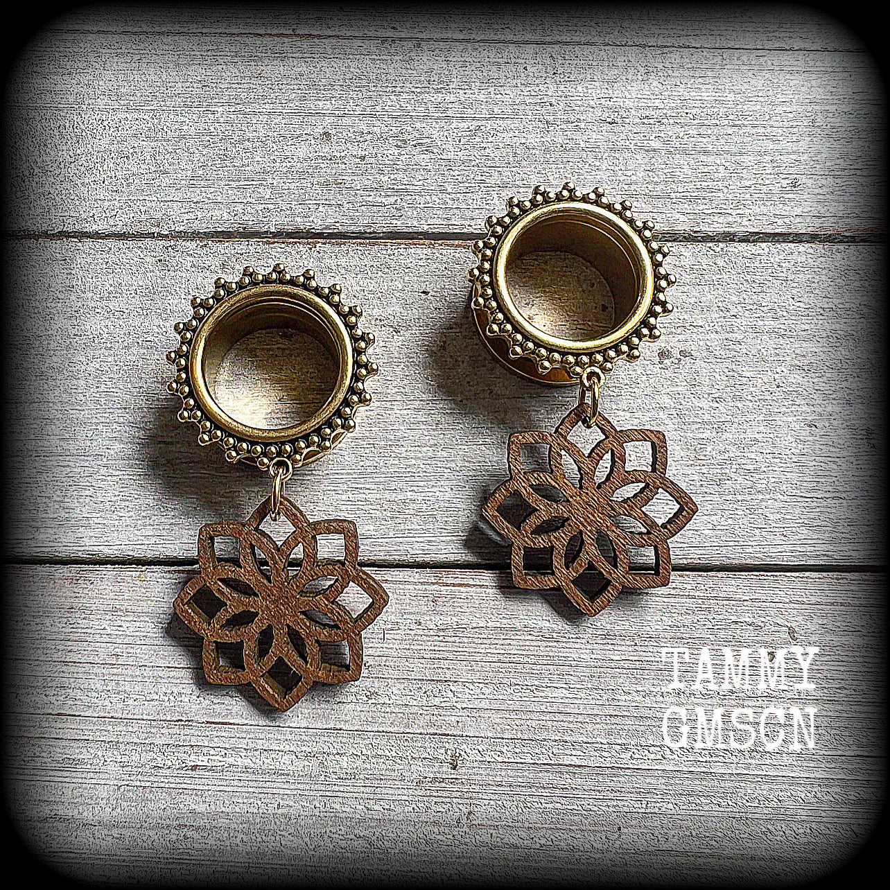 These boho tunnel earrings feature delicate wood mandala charms, are lovely and light weight at approx 8 grams each and measure just on 5 cms from tip to tip.
This pair has been made with 5/8" (16mm) gauge ornate surgical steel screw fit tunnels-for stretched lobes.
