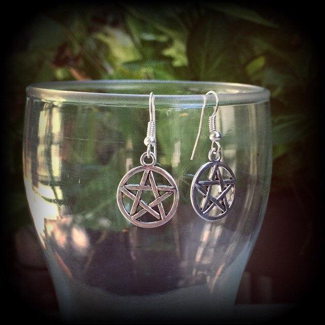 These antique silver pentagram earrings are light weight, weighing only a gram or two each and nice and dangly, measuring just over 4cms from tip to tip.
This pair has been made on stainless steel french hooks, suitable for pierced ears.