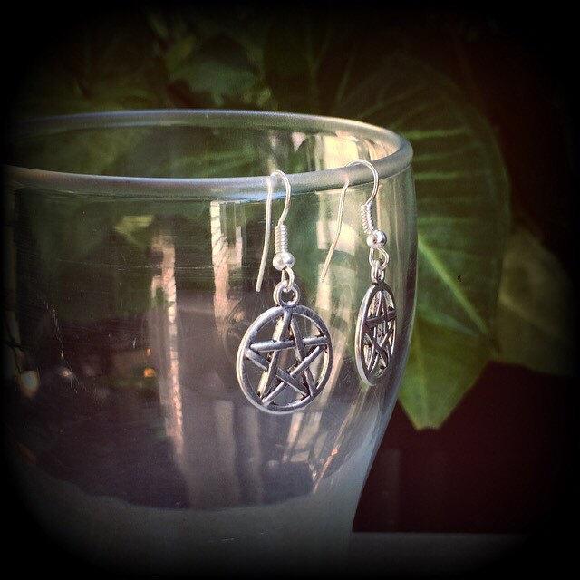 These antique silver pentagram earrings are light weight, weighing only a gram or two each and nice and dangly, measuring just over 4cms from tip to tip.
This pair has been made on stainless steel french hooks, suitable for pierced ears.