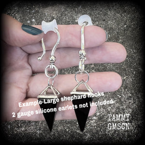 This is a pair of gorgeous pitch black onyx gemstone earrings, not too heavy at approx 10 grams a piece, and measuring just on 7cms from tip to tip.

This pair has been made with large antique silver shephards hooks, to be worn through silicone earlets in stretched lobes from 2 gauge (6mm).