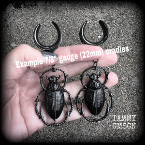 These gorgeous black enamel 'Scarab beetle' gauged earrings measure approx 9cms from tip to tip, and weigh approx. 16 grams a piece, not too heavy.
This pair has been made on 22mm surgical steel cradles, to be worn in stretched lobes.