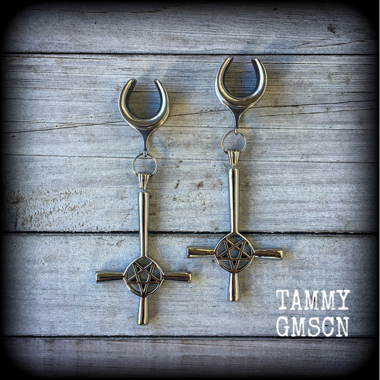 These gorgeous gothic earrings feature antique silver inverted cross and pentagrams, are nice and dangly, measuring just on 9 cms from tip to tip and weigh approx 15 grams each.

This pair have been made on 5/8" gauge (16mm) surgical steel cradles, suitable for stretched lobes.