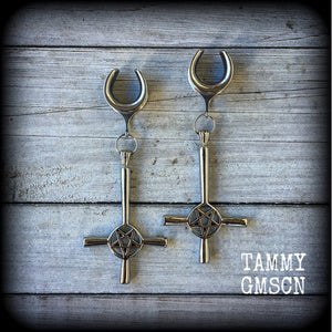 These gorgeous gothic earrings feature antique silver inverted cross and pentagrams, are nice and dangly, measuring just on 9 cms from tip to tip and weigh approx 15 grams each.

This pair have been made on 5/8" gauge (16mm) surgical steel cradles, suitable for stretched lobes.