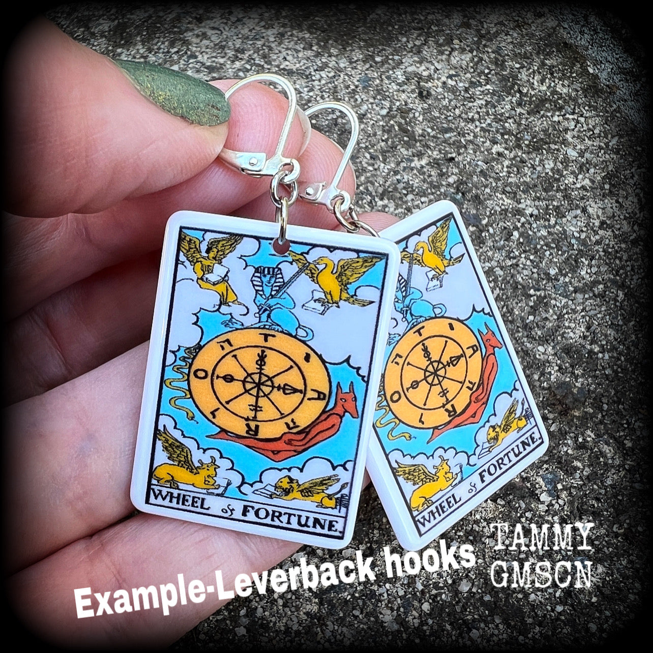 These earrings feature a lightweight acrylic 'Wheel of Fortune' tarot card charm, measuring just on 5cms from tip to tip, weighing only a gram or two each.

This pair has been made with antique silver leverback hooks, suitable for pierced ears or stretched lobes.