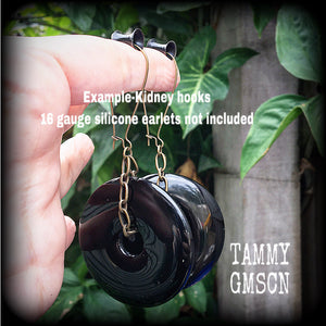 Black obsidian and antique bronze earrings measuring 9cms from tip to tip, weighing approx. 27 grams a piece.
This pair have been made with small antique bronze shephards hooks, to be worn through earlets in stretched lobes from 8 gauge (3mm).