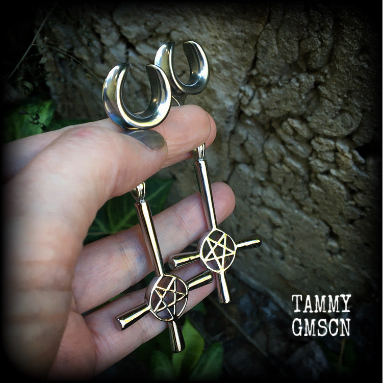 Upside down cross earrings These gorgeous gothic earrings feature antique silver inverted cross and pentagrams, are nice and dangly, measuring just on 9 cms from tip to tip and weigh approx 15 grams each.

This pair have been made on 5/8" gauge (16mm) surgical steel cradles, suitable for stretched lobes.