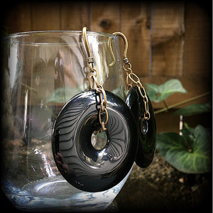 Black obsidian and antique bronze earrings measuring 9cms from tip to tip, weighing approx. 27 grams a piece.
This pair have been made with small antique bronze shephards hooks, to be worn through earlets in stretched lobes from 8 gauge (3mm).