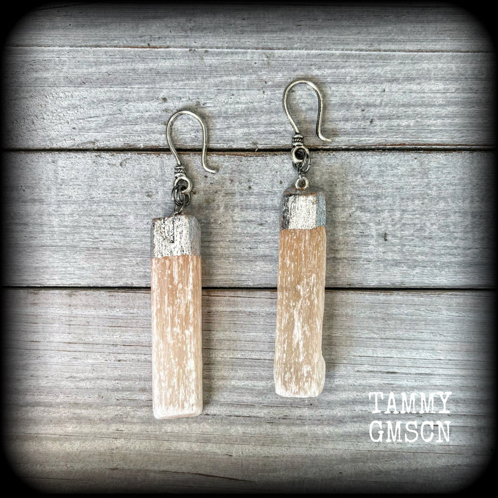 Featuring beautiful dusty pink selenite pieces, these earrings are nice and dangly, measuring approx 9cms from tip to tip, and not too heavy weighing in at approx 15 grams each.

This pair has been made on small antique silver shephard hooks to be worn through silicone earlets from 8 gauge (3mm).