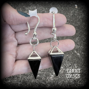 This is a pair of gorgeous pitch black onyx gemstone earrings, not too heavy at approx 10 grams a piece, and measuring just on 7cms from tip to tip.

This pair has been made with large antique silver shephards hooks, to be worn through silicone earlets in stretched lobes from 2 gauge (6mm).