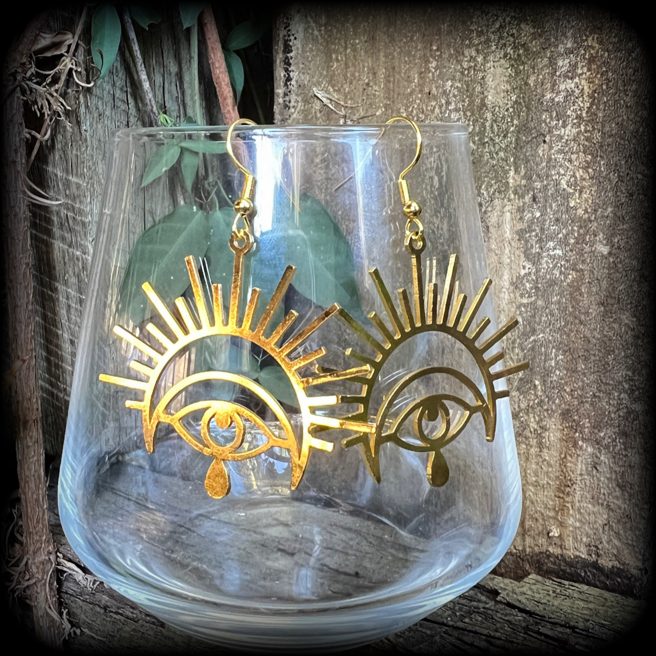 These gorgeous All seeing eye earrings have been made with titanium coated stainless steel charms, measure just on 6cms from tip to tip, and weigh only a gram or two each.

These earrings have been made on antique gold french hooks, suitable for pieced ears.