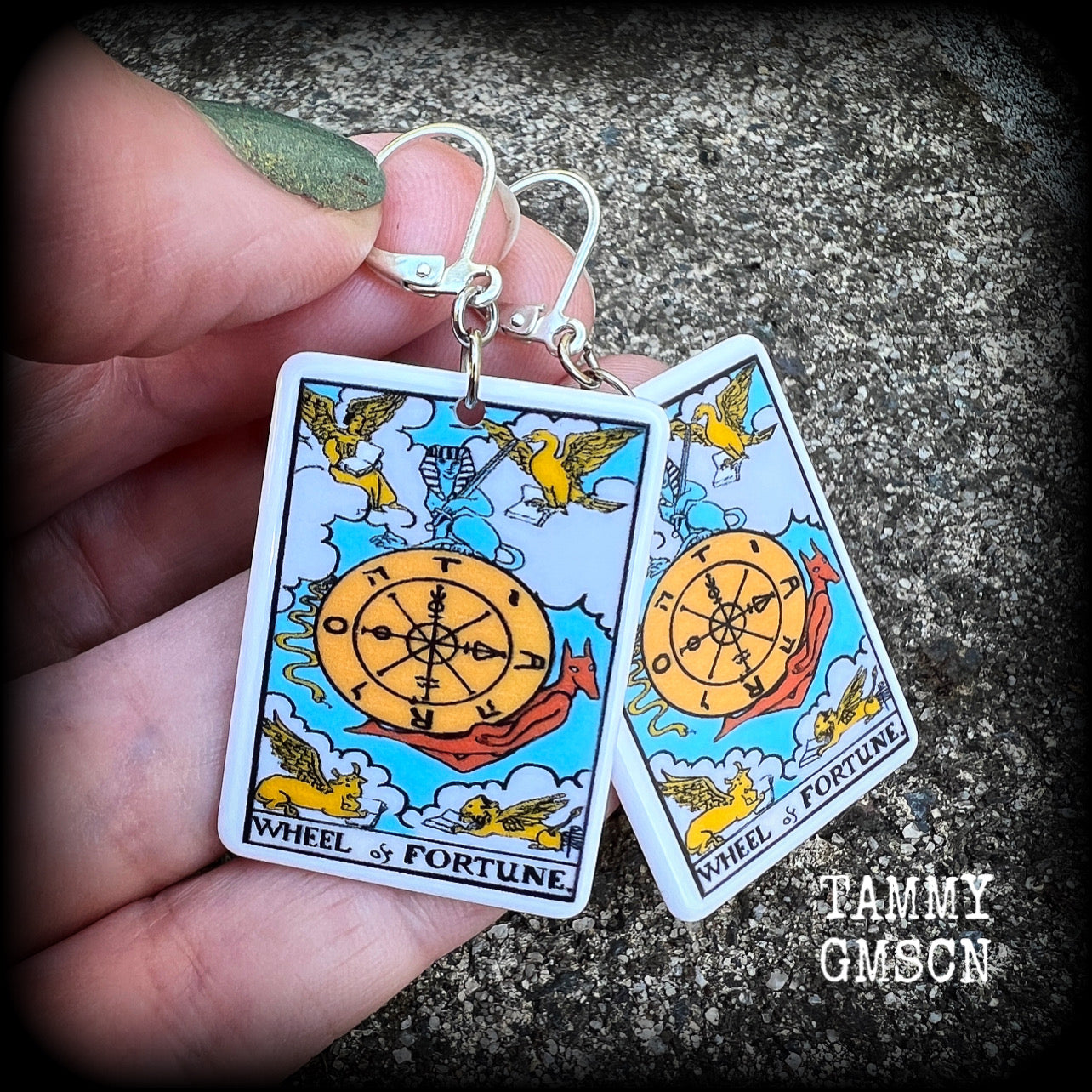 These earrings feature a lightweight acrylic 'Wheel of Fortune' tarot card charm, measuring just on 5cms from tip to tip, weighing only a gram or two each.

This pair has been made with antique silver leverback hooks, suitable for pierced ears or stretched lobes.