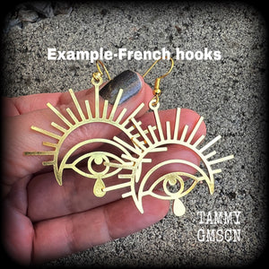 These gorgeous All seeing eye earrings have been made with titanium coated stainless steel charms, measure just on 6cms from tip to tip, and weigh only a gram or two each.

These earrings have been made on antique gold french hooks, suitable for pieced ears.