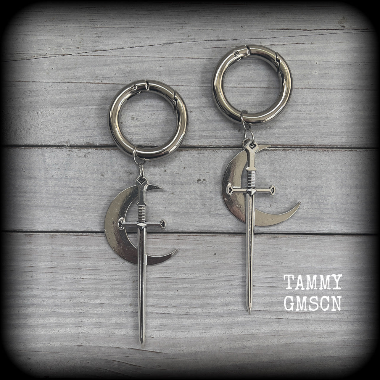 Sword and crescent moon gauged hoop earrings