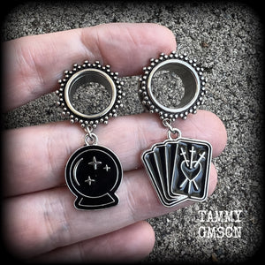 These gorgeous spooky tunnel dangles feature cute black enamel crystal ball and tarot card charms, are nice and lightweight-weighing only 7 grams each and measure 5cms from tip to tip.

This pair have been made on 5/8" (16mm) gauge ornate surgical steel screw fit tunnels.