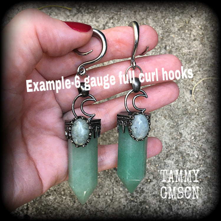 These gorgeous gemstone gauged earrings have been made with beautiful chunky seafoam aventurine and labradorite gemstone points, measuring just under 10 cms from tip to tip, and weighing approx 31 grams each.
These earrings have been made on 6 gauge (4mm) surgical steel full curl hooks, suitable for stretched lobes.