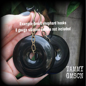 Black obsidian and antique bronze earrings measuring 9cms from tip to tip, weighing approx. 27 grams a piece.
This pair have been made with small antique bronze shephards hooks, to be worn through earlets in stretched lobes from 8 gauge (3mm).