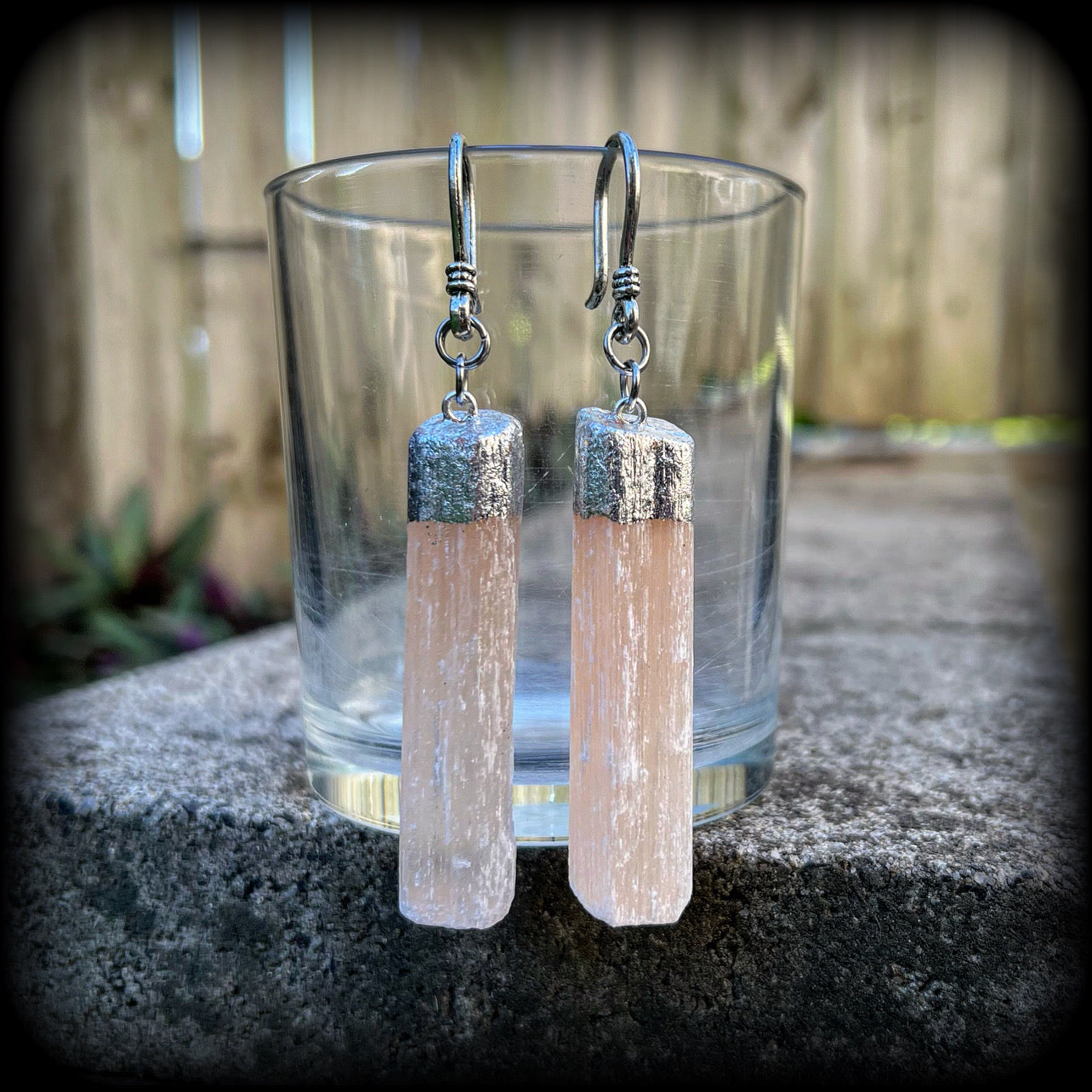 Featuring beautiful dusty pink selenite pieces, these earrings are nice and dangly, measuring approx 9cms from tip to tip, and not too heavy weighing in at approx 15 grams each.

This pair has been made on small antique silver shephard hooks to be worn through silicone earlets from 8 gauge (3mm).