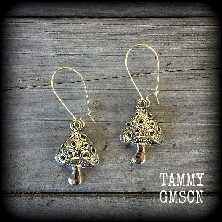 These adorable earrings feature antique silver mushrooms, measuring in at just under 6cm from tip to tip, and are nice and light weight at approx 6 grams each.

This pair has been made with antique silver kidney hooks, suitable for pierced ears or stretched lobes.