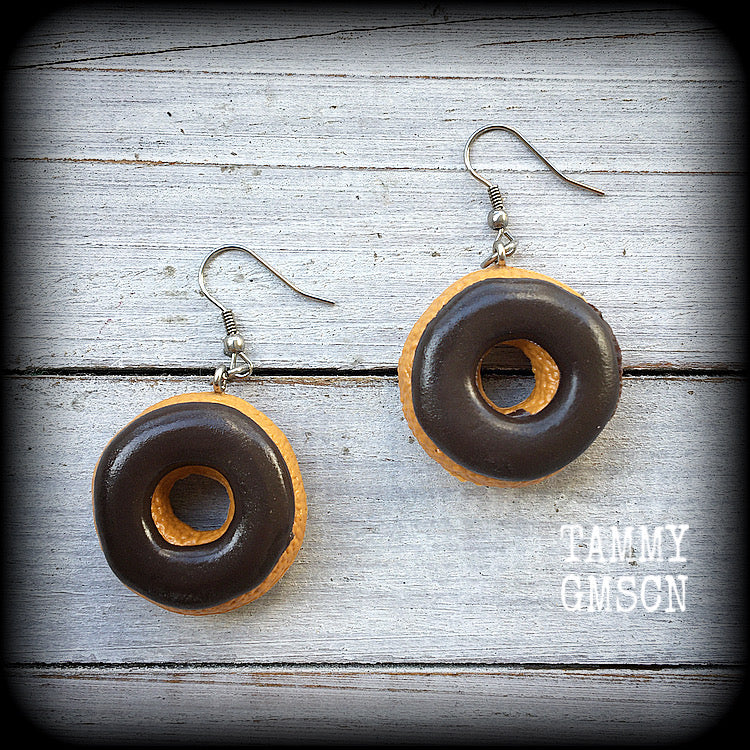 These awesome earrings feature classic chocolate iced doughnuts, measuring just over 5cms from itp to tip, and weighing approx. 9 grams a piece.

This pair has been made with stainless steel french hooks, for pierced ears. 