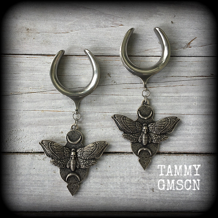 Featuring gorgeous antique silver deathshead moth pendants with crescent moons, these earrings are nice and dangly, measuring just over 9cms from tip to tip, and weighing approx 31 grams each.

This pair has been made on 1.18" (30mm) gauge surgical steel cradle hooks, suitable for stretched lobes.