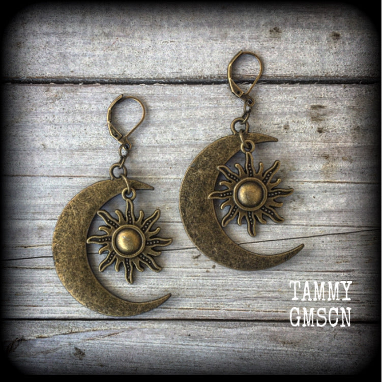 These gorgeous folk horror inspired earrings feature large antique bronze crescent moons with esoteric antique bronze suns, weight around 8 grams a piece, and measure just under 7cms from tip to tip.  This pair have been made with antique bronze leverback hooks, suitable for pierced ears or stretched lobes.