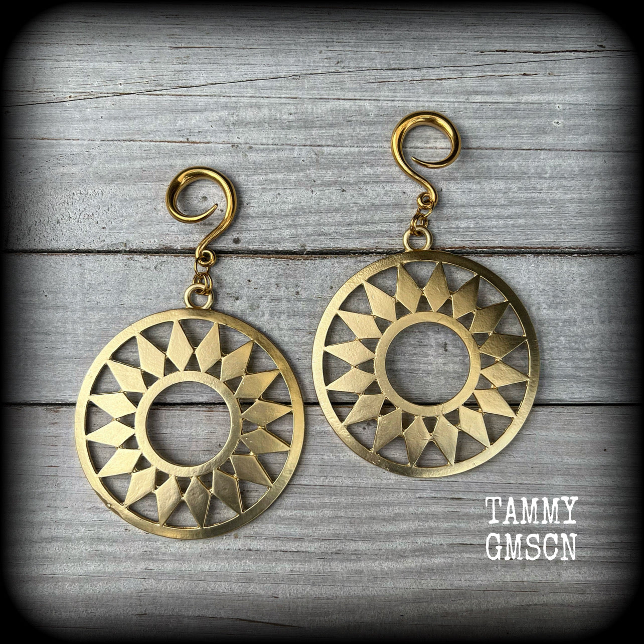 Inspired by Ishtar, Mesopotamian Goddess of love, beauty, sex and war, these beautiful antique gold tribal sun ear hangers weigh approx 17 grams a piece, and are big and beautiful measuring just on 10cms from tip to tip.

This pair has been made with 6 gauge (4mm) surgical steel full curl hooks, to be worn in stretched lobes.