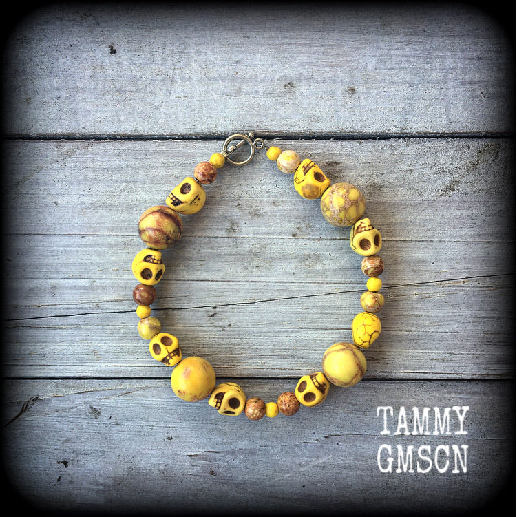 Featuring beautiful canary yellow skulls with gorgeous yellow ocean jasper beads, these bracelet measures 21cms when laying flat and fastens with an antique silver toggle clasp.

If you would prefer this bracelet made with a lobster clasp (rather than the toggle clasp shown), please be sure to choose that option when you go though checkout.