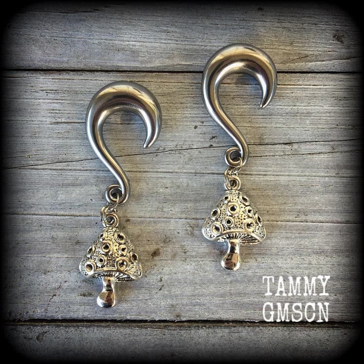 These antique silver mushroom gauged earrings are cute as a button and nice and light weight at 12 grams a piece, and nice and dangly at just under 7cms from tip to tip.

This pair has been made with 0 gauge (8mm) surgical steel half curl hooks, to be worn in stretched lobes.