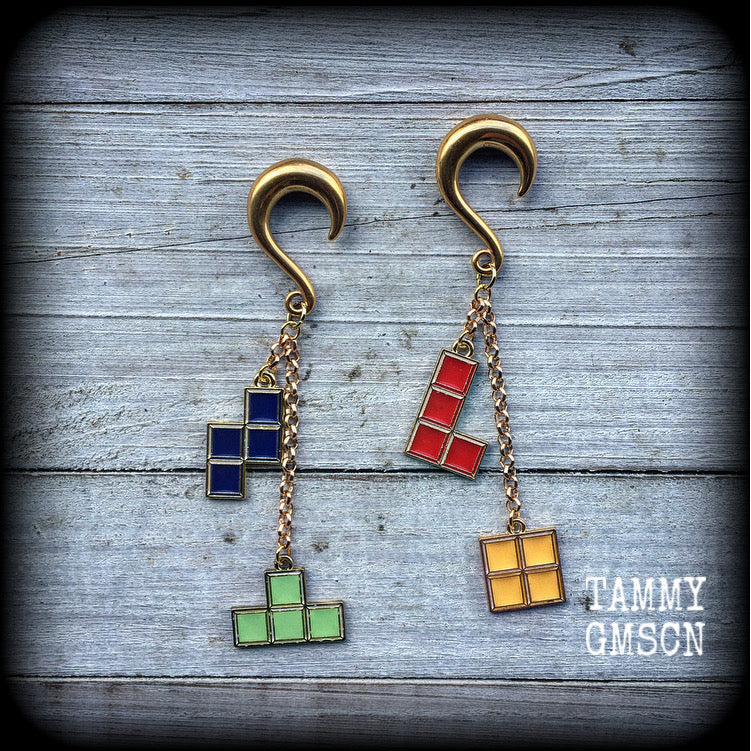 This pair of fabulously retro arcade game earrings are nice and lightweight at only 9 grams a piece, and measure just on 9cms from tip to tip.

This pair have been made with 2 gauge (6mm) surgical steel half curl hooks-suitable for stretched lobes.