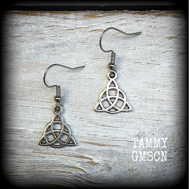 These gorgeous earrings feature antique silver celtic trinity knots, are light weight at only a gram or two each and measuring just on 3cms from tip to tip.

This pair has been made with stainless steel french hooks, to be worn through pierced ears.