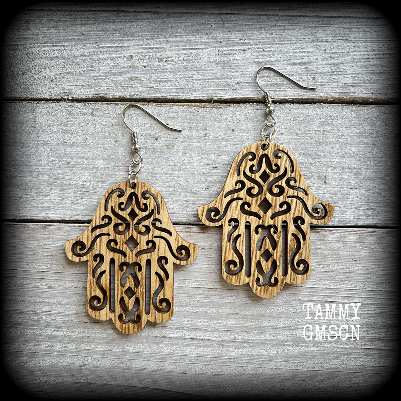 These gorgeous earrings feature lightweight wood hamsa hands, measuring just on 7cms from tip to tip and weighing only a few grams each.

This pair has been made with stainless steel french hooks, suitable for pierced ears.