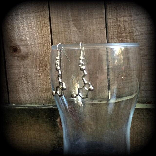 These cute little antique silver Serotonin molecule earrings measure just under 5cms from tip to tip, and are super light weight at only a few grams each.

This pair have been made with stainless steel french hooks, to be worn in pierced ears.