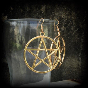 These are beautiful earrings feature large champagne gold pentagrams ,light weight (weighing only a few grams each) and nice and dangly, measuring just on 8cms from tip to tip.

This pair has been made on antique gold french hooks, suitable for pierced ears.