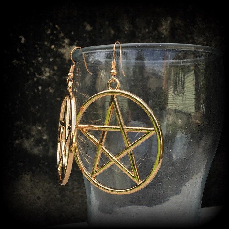 These are beautiful earrings feature large champagne gold pentagrams ,light weight (weighing only a few grams each) and nice and dangly, measuring just on 8cms from tip to tip.

This pair has been made on antique gold french hooks, suitable for pierced ears.