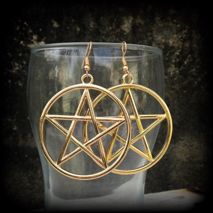 These are beautiful earrings feature large champagne gold pentagrams ,light weight (weighing only a few grams each) and nice and dangly, measuring just on 8cms from tip to tip.

This pair has been made on antique gold french hooks, suitable for pierced ears.