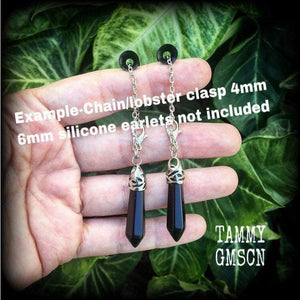 This gorgeous pair of pitch black obsidian earrings are nice and lightweight and nice and dangly, measuring just on 6cms from tip to tip and weighing in at 5 grams each piece.
This pair have been made on our super versatile antique silver chain and lobster clasp 4mm option, to be worn through silicone earlets in stretched lobes from 6 gauge (4mm).