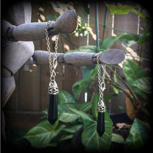 This gorgeous pair of pitch black obsidian earrings are nice and lightweight and nice and dangly, measuring just on 6cms from tip to tip and weighing in at 5 grams each piece.
This pair have been made on our super versatile antique silver chain and lobster clasp 4mm option, to be worn through silicone earlets in stretched lobes from 6 gauge (4mm).