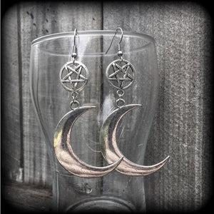 Featuring large antique silver crescent moons hanging from antique silver inverted pentagram charms, these gorgeous gothic earrings measure just on 10cms from tip to tip and weigh approx 6cm each.

This pair has been made with stainless steel french hooks, for pierced ears.
