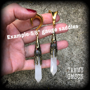 These gorgeous gothic gemstone gauged earrings feature beautiful cloudy quartz and antique bronze gemstone points, measuring just over 10 cms from tip to tip, and weighing approx 15 grams each.
These earrings have been made on 5/8" gauge (16mm) surgical steel saddles, to be worn in stretched lobes.