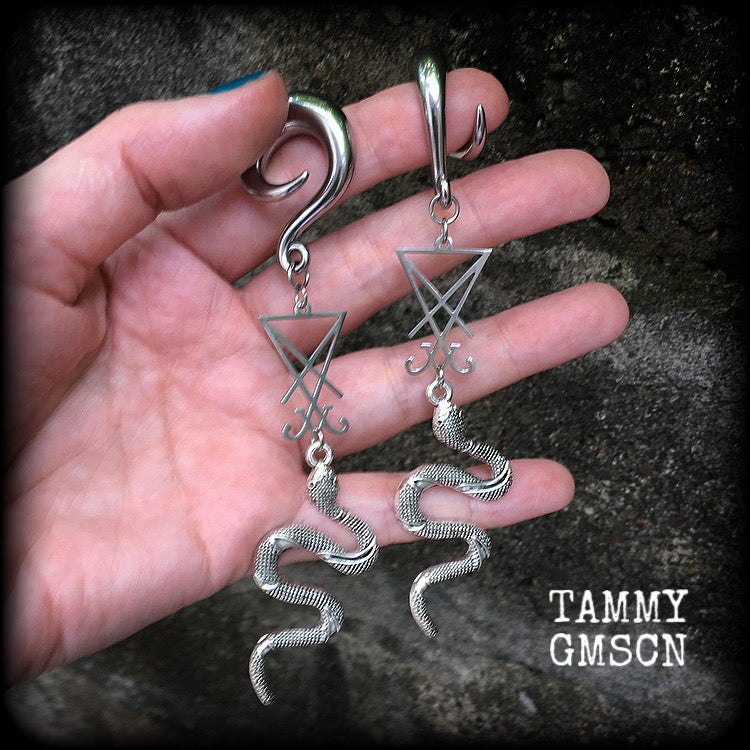 These gorgeous 'Snake and Sigil' gauged earrings feature an antique silver snake (Lilith) hanging from a stainless steel Sigil of Lucifer charm.
These are nice and dangly at 12cms from tip to tip and weigh approx 20 grams each, not too heavy.
This pair have been made on 0 gauge (8mm) surgical steel full curl hooks, suitable for stretched lobes.