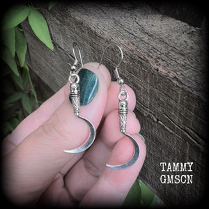 Featuring super cute super lightweight antique silver grim reaper scythes, these earrings are lovely and petite, measuring just under 5cms from tip to tip and weigh only a gram or two each.

This pair has been made with stainless steel french hooks, for pierced ears.