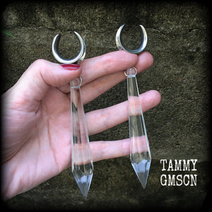 These gorgeous dangly glass earrings have been made with gorgeous faceted clear glass spears, measuring 13 cms from tip to tip, and weighing approx 13 grams each.

These earrings have been made on 3/4" gauge (19mm) surgical steel cradles, to be worn in stretched lobes.