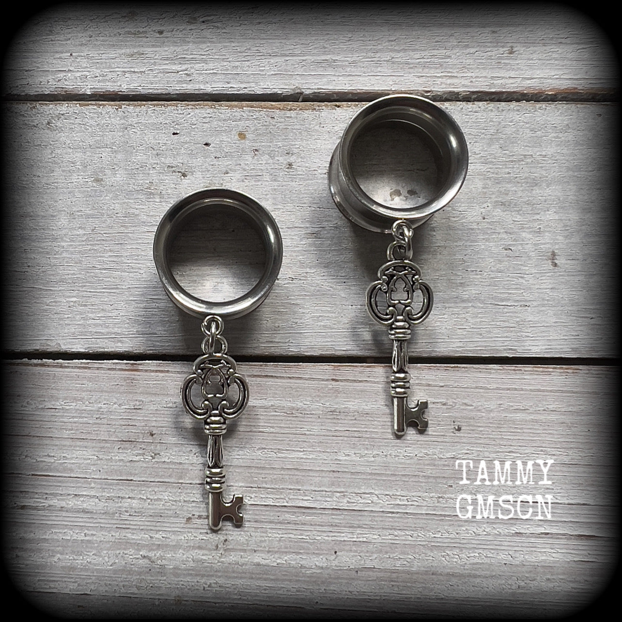 Antique silver key tunnel earrings